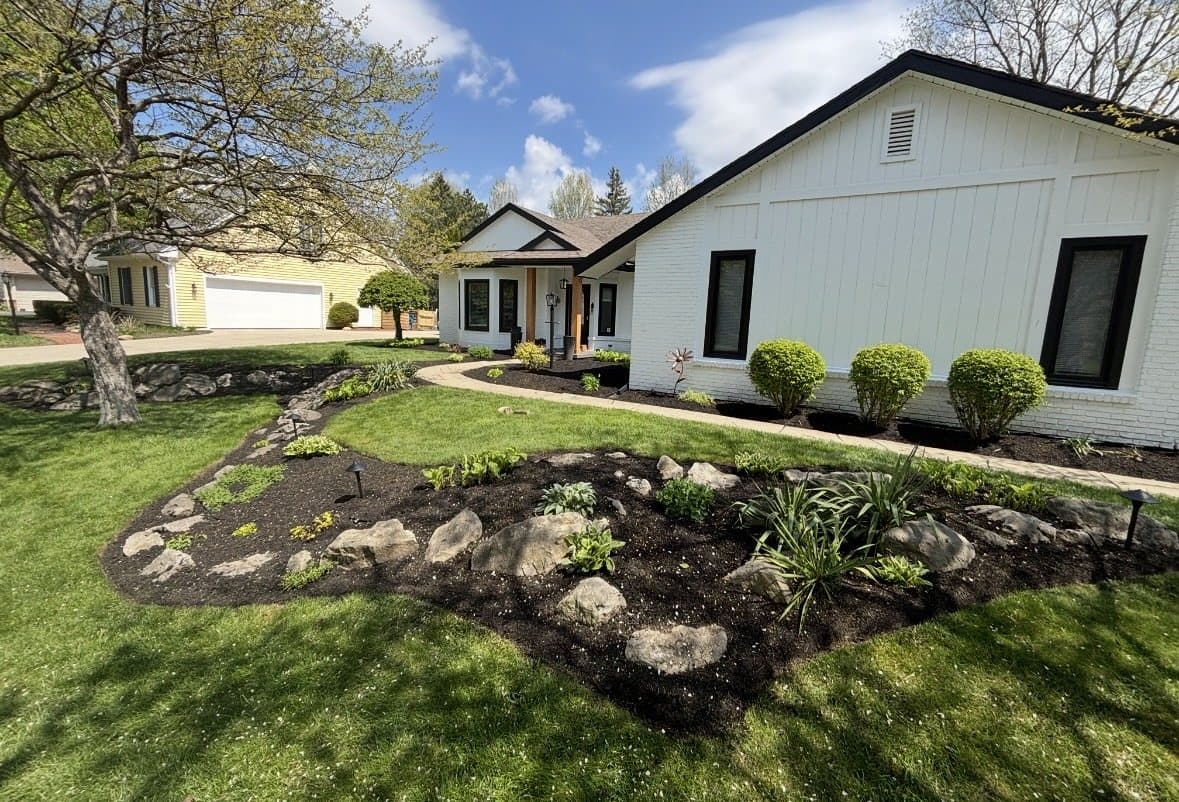 Fresh black mulch and professionally finished landscape beds